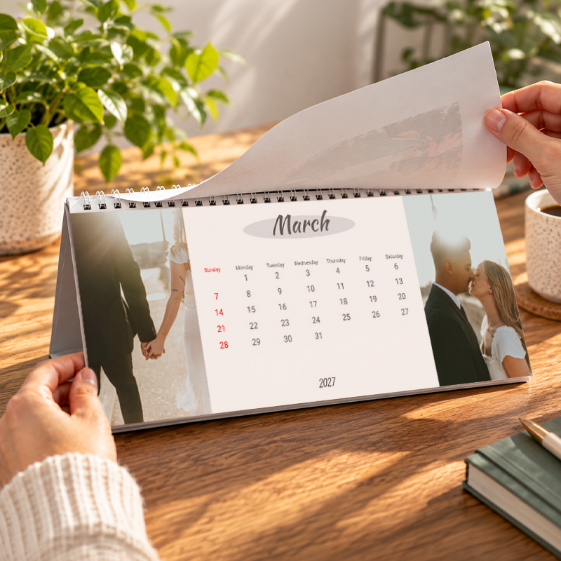 Personalised desktop calendar being flipped through