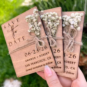 Minimal floral engraved wooden save the date magnet with preserved eucalyptus